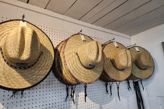 Many straw hats, all sizes